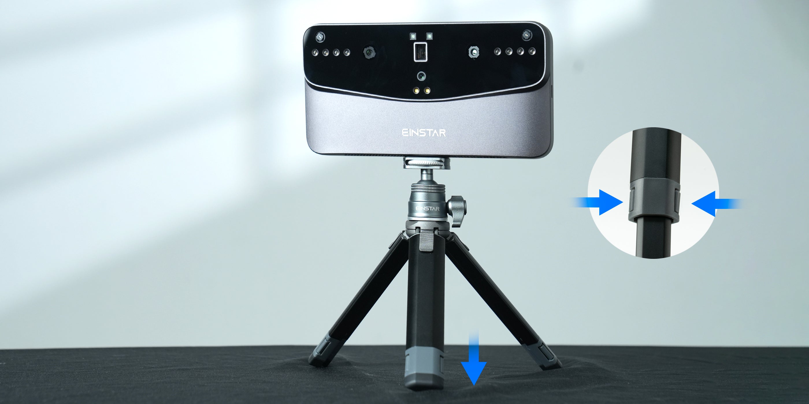 Extendable two-section tripod supporting an EINSTAR VEGA 3D scanner. The design allows for height adjustment, offering more creative angles. A close-up inset highlights the tripod’s extension mechanism.