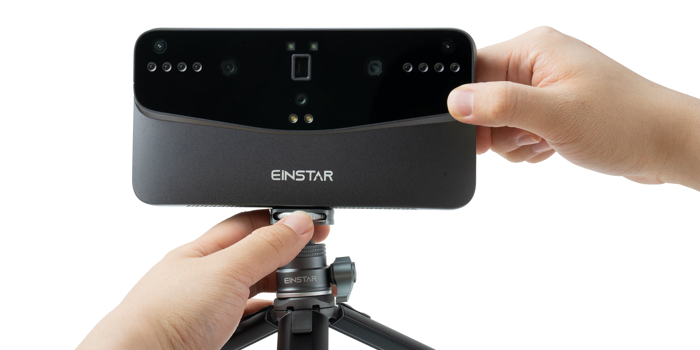 Hands securing an EINSTAR 3D scanner onto a tripod using the quick-lock dial design, allowing for easy positioning and rapid installation of the device.